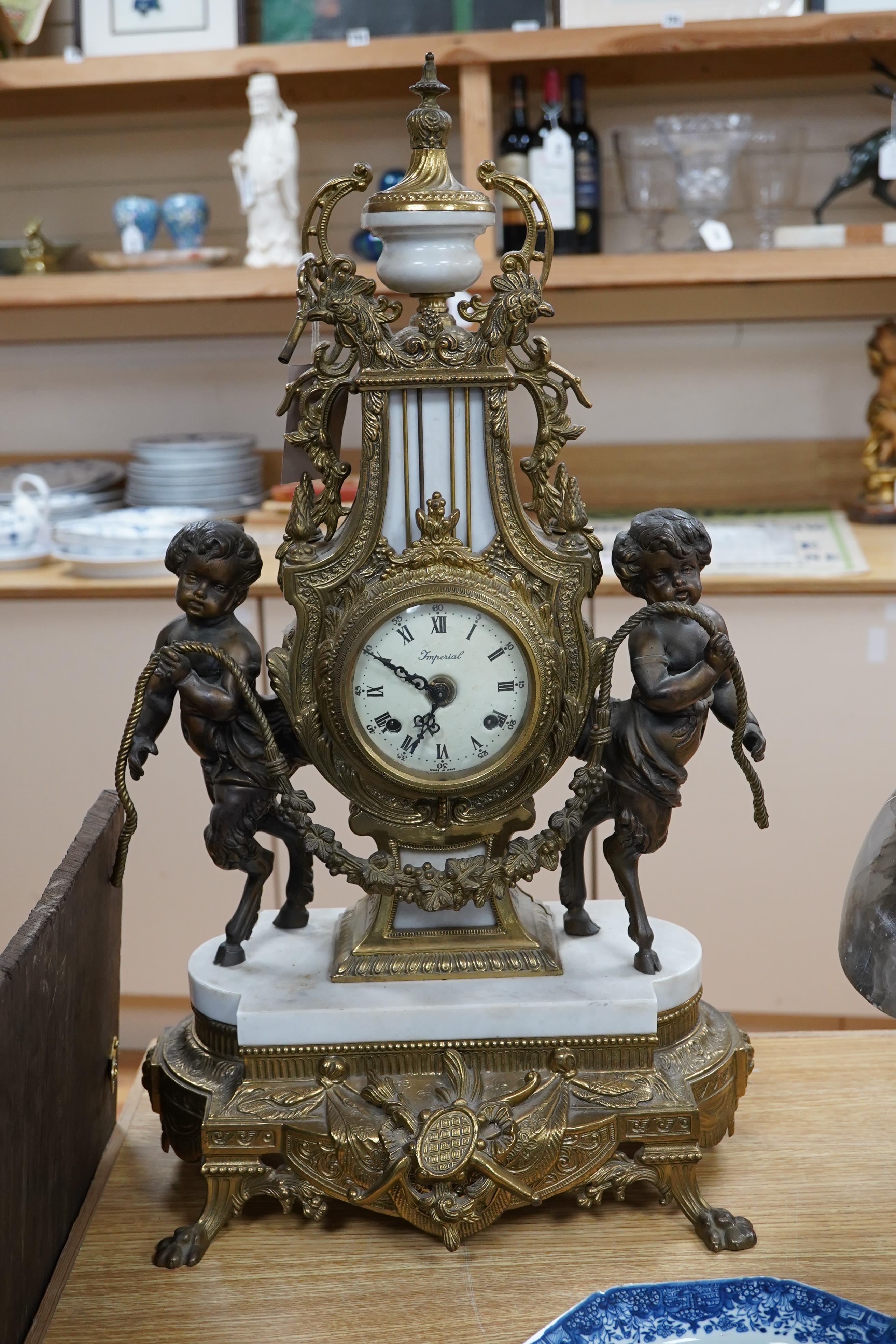 A Louis XV style brass and marble mantel clock, with key, 60cm tall. Condition - good